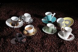 Porcelain espresso cups on coffee beans