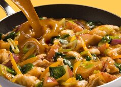 Potato curry with spinach, yellow peppers, spring onions and cauliflower