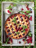 A summery fruit pie with a lattice top for a picnic
