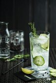 A cocktail with cucumber and rosemary