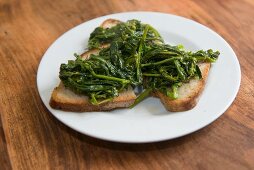 Steamed broccoletti on a sliced of bread