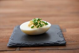 A devilled egg with chives