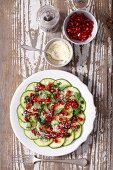 Courgette carpaccio with pomegranate seeds, pecorino cheese and mint sauce