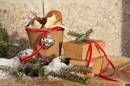 Christmas biscuits in plant pot next to cardboard boxes