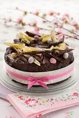 An Easter cake with chocolate glaze and sugared eggs