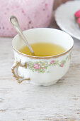 Spring herb tea in an antique mug