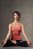 A woman meditating in a yoga position