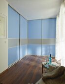 DIY wardrobes with floor-to-ceiling, blue sliding doors