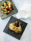 Chicken legs with a nut crust and a side salad