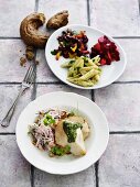 Chicken with pesto and various side salads
