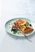 Oven-baked salmon trout with olive and orange salsa