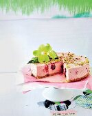 Cherry cheesecake with pistachio nuts and sesame seeds