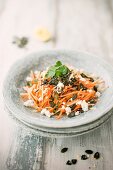 Carrot and apple salad with feta cheese and pumpkin seed pesto