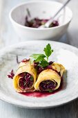 Pancake rolls with a red cabbage salad