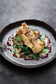 Fried turbot with truffles, spinach and a red wine and butter sauce