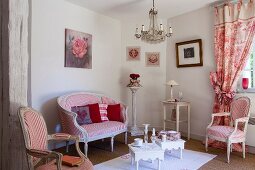 French furniture and red and white fabrics in seating area