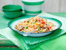 Vegetable rice in a green enamel bowl