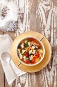 Fish soup with carp, tomatoes and potatoes for Christmas