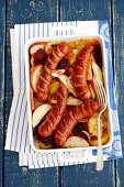 Sausages with potatoes, beetroot, apple and onion