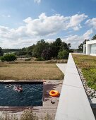 Pool area with wooden surround and view across rural landscape