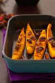 Baked pumpkin wedges with walnuts and cinnamon