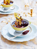 Dark chocolate pudding with salted caramel brittle served in a cup