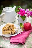 Apple pie on a plate with apple blossoms