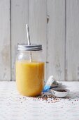 A chamomile and mango smoothie with pineapple with flaxseeds