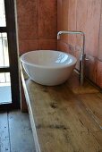 Modern countertop sink on rustic board