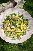 Spring salad with avocado and pansies