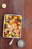 Salmon bake with potatoes, leeks, spinach and peppers