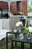 Rustic wedding with seating on bales of straw and side tables