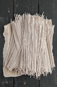 Soba noodles on a dark wooden table