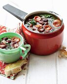 Chorizo and kidney bean soup with spinach