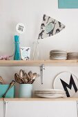 Light blue kitchen accessories on shelves