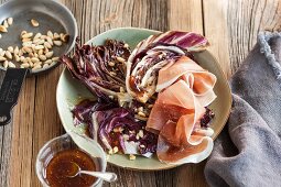 Roasted radicchio with air-dried ham and pinenuts
