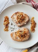 Tuna fish steaks with white wine onions