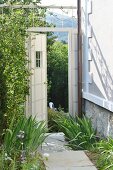 Stone-flagged garden path and view of hills