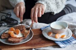 Breakfast in bed: French toast with cinnamon and citrus yoghurt