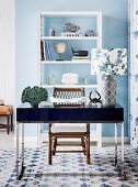 Pattern mix at the desk with a maritime flair; cubic desk with table lamp and floral patterned lampshade