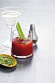 A Margarita with a lime-salt rim and a Bloody Mary with a stalk of celery