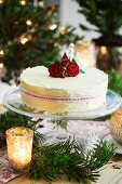 A Christmas cake with red roses