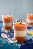 Ice cold layered desserts with papaya and lime-and-coconut cream