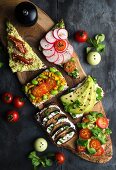 Wholemeal open sandwiches topped with soya quark and various vegetables