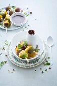 Mango, fig and coconut skewers served with a chocolate and coconut sauce