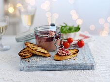 Pâté in a flip-top jar with grilled bread for Christmas