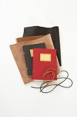 Presents being made: notebooks being covered in leather