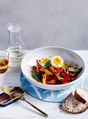 Paprika vegetables with egg and basil