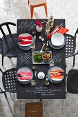 Set chalkboard table with menu written in white