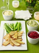 Crispy potato skins with beetroot dip, cashew dip and pine nut cream cheese dip